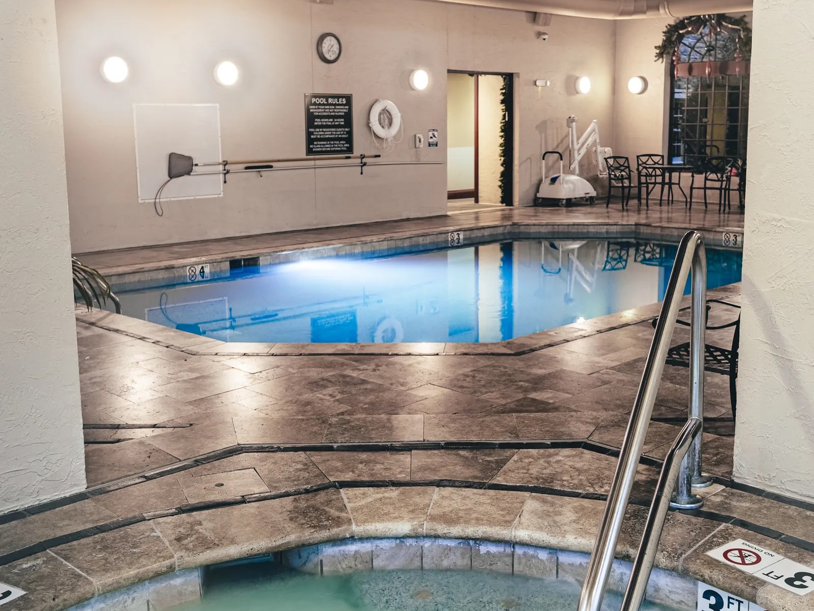 Renovated commercial indoor pool with travertine deck at a Pigeon Forge resort, by Morales Outdoor Living